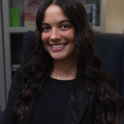 Hannah-VOH-2-scaled Hannah smiling at the camera in a black top
