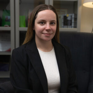 Mackenzie-VOH-scaled Mackenzie smiling lightly wearing a black blazer over a white shirt